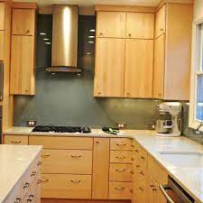 The light fixture is a good statement piece for the kitchen. Maple Cabinets Design Ideas Pictures Remodel And Decor Kitchen Design Modern Kitchen Backsplash Kitchen Cabinets And Countertops