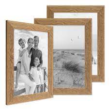 Ein rahmenloser bildhalter, auch cliprahmen genannt. 3er Set Bilderrahmen 21x30 Cm Din A4 Strandhaus Rustikal Eiche Optik Natur Massivholz Mit Glasscheibe Inkl Zubehor Fotorahmen Photolini Bilderrahmen Fotowande Poster Und Geschenke