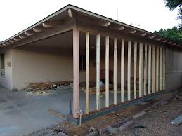 The roofline of the new garage matches the house and makes room for storage overhead. Carport To Modern Garage Conversion Project Construction Llc
