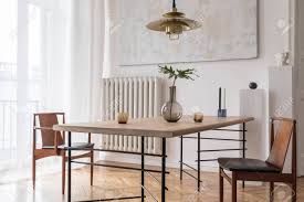 Whether you want your dining room to be elegant and formal or cozy and friendly, modern dining room lighting fixtures can be used to complete the ambiance. Stylish And Modern Dining Room Interior With Design Sharing Table Stock Photo Picture And Royalty Free Image Image 122960393