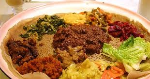 Ethiopian Food Is Served On A Piece Of Injera With Many Dishes To Try One Of The Benefits Of Life In New York Ethiopian Food African Food Nutrition Recipes