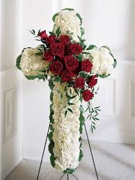 An example of a standing spray that can be sent by the extended family. A Funeral Flower Cross Of White Carnations With A Red Rose Spray Funeral Flowers Funeral Floral Arrangements Funeral Flower Arrangements