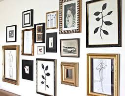 Black And Gold Picture Frames Uk Idea To Implement In Our Hallway Love The Mix Of Frames With Neutral But Bold Black And Gold Gallery Wall Gold Frame Gallery Wall Black And White Picture Wall