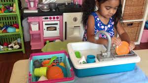 kids play kitchen sink with a running