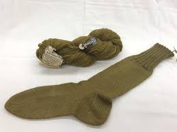 These fingerless knitted gloves have a bit of light lace detail at the cuff that makes them an elegant and fun. Showing Support For The Great War With Knitting Needles National Museum Of American History