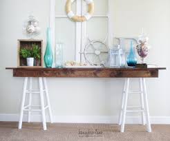 Round farmhouse bar, pub table height. Pottery Barn Knockoff Sawhorse Console Table Diy Table Top Designs Diy Storage Table Decor