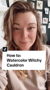 How to- Watercolour Witchy Cauldron 1. With black, paint a semi circle.  Then a sort of roundish circle for the cauldron body. 2. Paint two little  feet at the bottom. 3. With water in your brush, pull ...