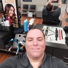 Hey quick question, is it against the law in Iowa to do Barber work as a  Cosmo??