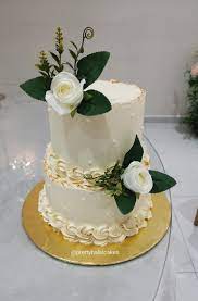 Use sunflowers to quickly add personality and color to a white buttercream wedding cake. Buttercream Wedding Cake With White Roses In 2021 Buttercream Wedding Cake Wedding Cakes Butter Cream