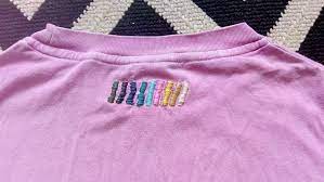 Embroidered Logo To Cover Holes Where The Internal Label Is Stitched Into The Tshirt Mending Clothes Shirt Embroidery Visible Mending