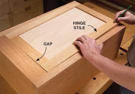 With a gap of 1/16 around each door ( i assume you are making inset doors) i find it makes for a better look. Aw Extra 1 24 13 How To Hang Inset Doors Popular Woodworking Magazine