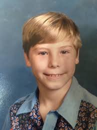 How to remove a picture stuck to glass without damaging it?