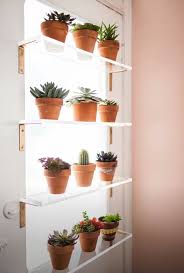 This easy wooden plant stand will give you more room to store your plants without taking up more space in your window. Shelves Across A Window For More Pants Kitchen Window Shelves Plant Shelves Window Plants