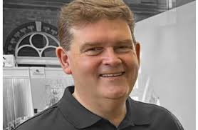 Sadness at sudden passing of popular Stockport business leader Julian  Lewis-Booth