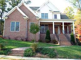 Even more so if the home has architectural details like the stucco corners, front porch and interesting roof line. What To Paint The Siding Of A Pink Brick House Hunker Brick Exterior House Brick House Siding Red Brick House Exterior