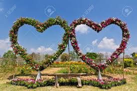Garden bench park bench metal bench outdoor benches clearance patio yard bench floral rose accented bronze. Floral Love Seat Bench In Flower Garden Stock Photo Picture And Royalty Free Image Image 12531578