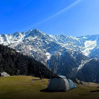 The ultimate reward: Camping at the Triund ridge under the Dhauladhar range., AI generated