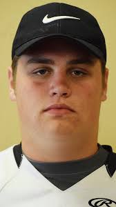 Justin Newcomb, right, is the new coach at Cousino…