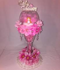 Wholesale baby shower centerpieces from oriental trading come in a wide variety of shapes and styles to complement your baby shower theme and the palm tree and under the sea centerpieces add a tropical touch, and the tissue paper pacifiers are just plain adorable. 20 Unique Baby Shower Centerpieces That Brighten Up The Party