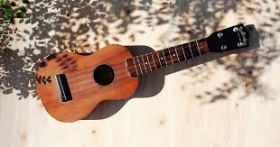 5) martin acoustic guitar body m600. Holding Onto A Dream Playing The Ukulele By A Campfire