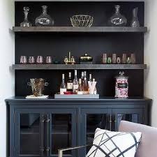 It features a rectangular silhouette with a wood finish for rustic appeal. Wallpaper Behind Bar Shelves Design Ideas
