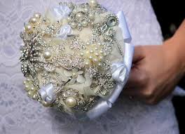 A vintage brooch bouquet is a collection of ecletic vintage brooches assembled to take the form of a bouquet. Diy Brooch Wedding Bouquet Made Of Vintage Family Brooches And Pearls