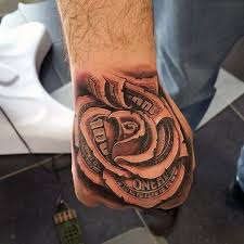 Flower Tattoos Men Flowertattoosformen Rose Tattoos For Men Hand Tattoos Hand Tattoos For Guys