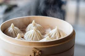 Line the steamer basket with a large lettuce leaf. Xiao Long Bao Soup Dumplings China Sichuan Food