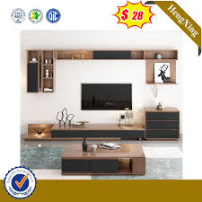 Haotuo furniture located at the lecong town furniture center nearby, is one has the davanced poroduction equipment, also is one enterprise with specialized designers and the high quality staff team's,we are dealing in home furniture with wine. China Best Price Tv Stands Design Mdf Tv Unit Cabinet With Drawer China Coffee Table Glass Home Furniture