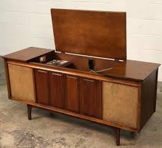 Perched atop classic tapered legs, this storage console features three divided sections sized perfectly for your precious vinyl. Refurbished Midcentury Stereo Console Vintage Stereo Console Vintage Stereo Cabinet Stereo Console