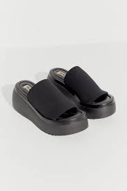 Stretchy banded strap across the arch, with a peep. Steve Madden Slinky Platform Sandal