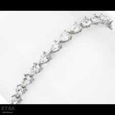 Shop at our store for dazzling jewelry. 18k White Gold Pear Shaped Diamond Tennis Bracelet