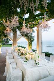 A Touching Vow Renewal Overlooking The Ocean In Santa Barbara Inside Weddings Wedding Reception Dinner Wedding Inside Wedding Chandelier