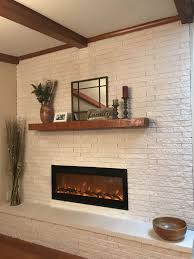 This article gives typical clearance distance requirements between the termination cap of a gas fireplace or fireplace insert and other building or site features such as windows, doors, other mechanical system components, air intakes. Mid Century Modern Fireplace And Mantel Mid Century Modern Fireplace Makeover Mid Century Modern Fireplace Midcentury Modern Fireplace