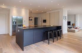 Your kitchen bar stools can simply say, i'm a handy place to sit while resting a minute or while preparing food. you can dress up your existing kitchen island with bar stools that you have made or that you have purchased, or you can buy the island and bar stools as a matched set. Modern Black Kitchen Island Breakfast Bar Integrated Fridge Freezer Built In Kitchen Units Kitchen Design Small Black Kitchen Island Kitchen Island Plans