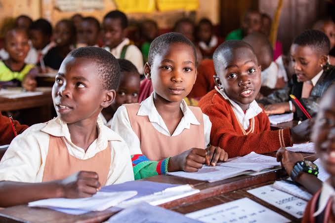Students in a classroom, Northern Pride Group Education, Gulu