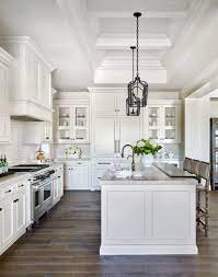 Traditional kitchen featuring an island that also serves as a breakfast bar. 20 Breathtaking Farmhouse Kitchens The Unlikely Hostess In 2020 Farmhouse Kitchen Design White Kitchen Design Gorgeous White Kitchen