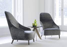 Our arm chair has the look, feel, and design of contemporary style with its upholstery and sloped arms. Contemporary Armchairs Contemporary Armchair Fabric Leather High Back High Back Armchair Contemporary Armchair Armchair Design