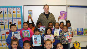 College student donates books to elementary school