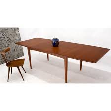 The simple, modern design of the chintaly tara pop up extension glass dining table lends a spacious feel to any size dining room. Danish Mid Century Modern Teak Dining Table With Two Pop Up Self Storing Leaves Chairish