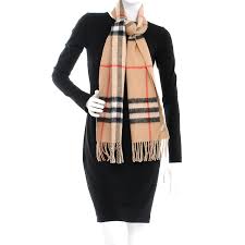 Using 30 different steps, the scarf is woven on traditional looms. Burberry Metallic Polyester Cashmere Giant Check Reversible Fringe Scarf Camel 238908 Fashionphile