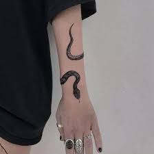 If you're looking for a rad font to go along with your cross tattoo, check our this curated collection: 55 Inspiring Snake Tattoos For Both Men And Women Inspirationfeed