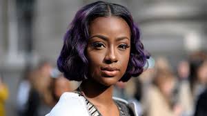 Purple with black highlights and a feathers in her hair. Purple Hair Color Ideas You Can Actually See Yourself Wearing Stylecaster