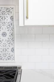Hexagon tiles in taupe, gray and cream make a darling backsplash for this neutral bathroom's shower and tub. White Subway Tile With Gray Grout My Favorite Grays Driven By Decor