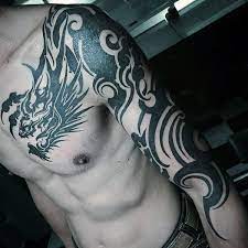 Tribal arm and shoulder tattoo. 60 Tribal Dragon Tattoo Designs For Men Mythological Ink Ideas