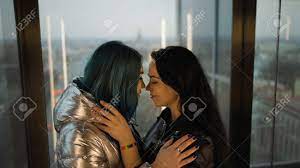 Moving Lift: Cute Lesbian Couple Join Noses Near Window Stock Photo,  Picture and Royalty Free Image. Image 159309329.