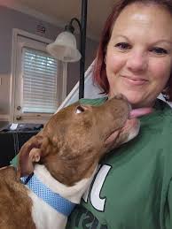 One proud foster mama of a snuggly pup