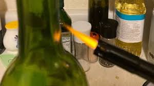 Cut the foil beneath the bottle's lower lip. How To Open Wine With A Lighter