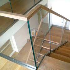 Hole on each side of all bumpers, through the bottom rail, so water won't collect where the glass and bottom rail meet. Apartment Staircase U Channel Glass Railing With Wood Tube Handrail China Railing Glass Railing Made In China Com