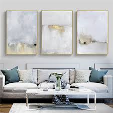A grey living room would look both formal and stylish, and adding different hues of greens to it, makes a whole lot of difference. Gold And White Abstract Canvas Painting Modern Cuadros Home Living Room Decoration Canvas Prints Wall Art Posters And Prints Art Painting Calligraphy Aliexpress